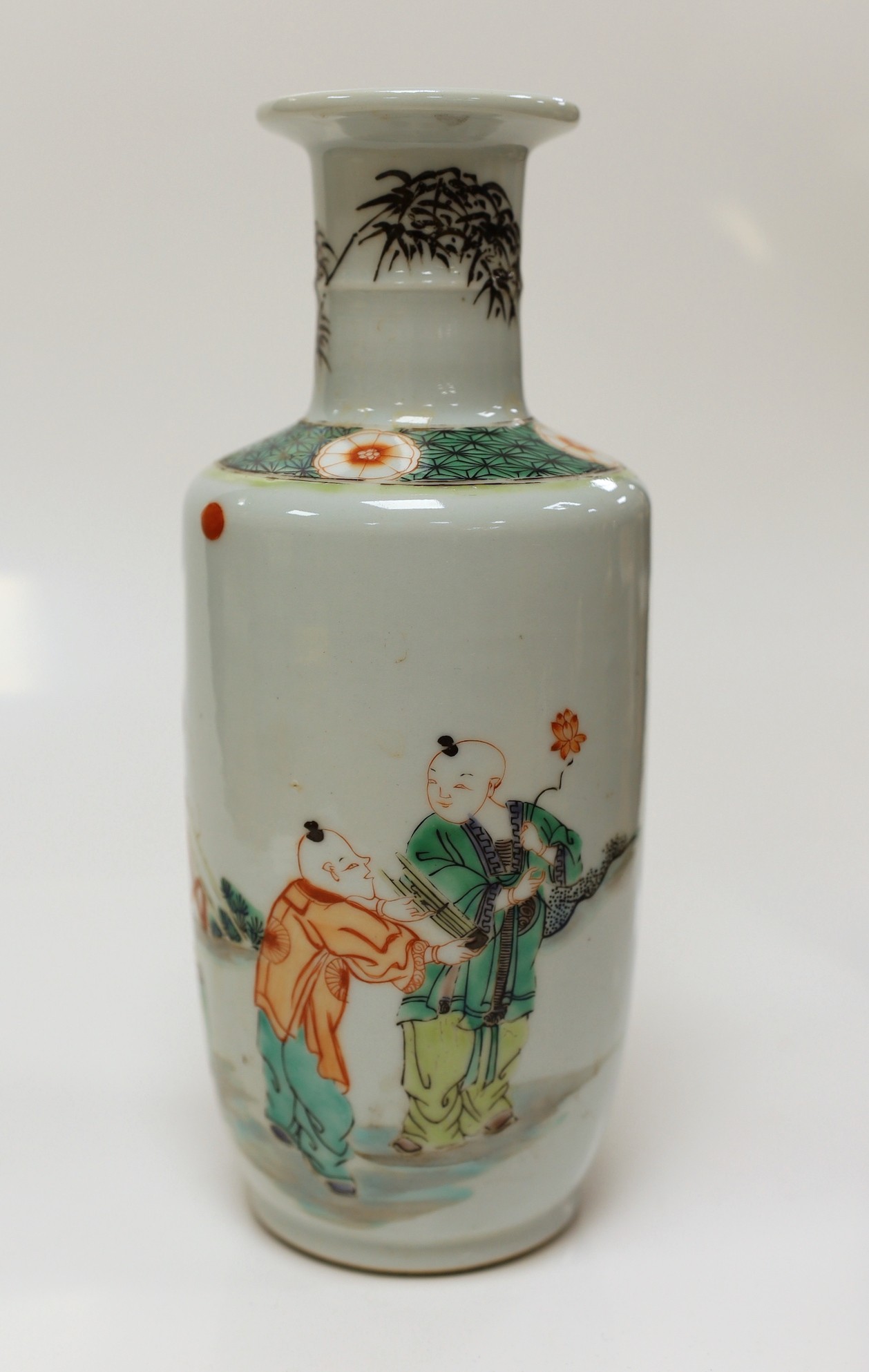 A Chinese famille verte rouleau vase depicting figures in landscape, 22.5cm tall